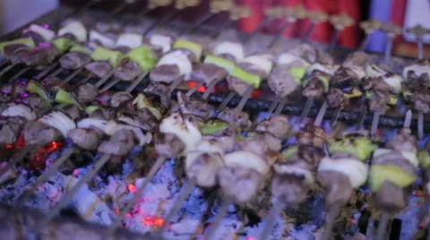 Juicy roasted kebabs on the BBQ, colored barbecue, Chicken kebab on grill Stock Footage 51231727