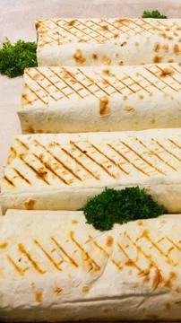 Juicy Shawarma close-up. Close up view of eat fresh street fast food. dish with Stock Photos