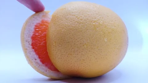 A juicy slice of grapefruit 스톡 동영상 331746465
