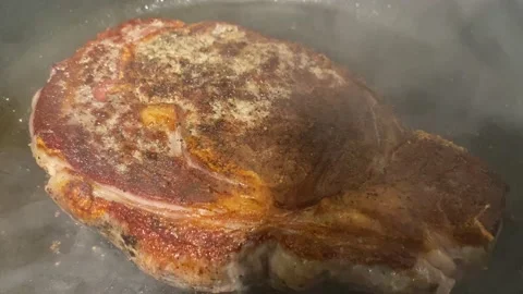 Juicy Steak Cooked in a Pan on Burner Stock Footage 151761804