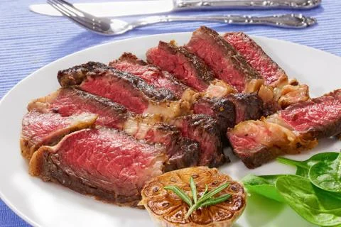 Juicy steak medium rare beef with spice, close-up Stock Photos