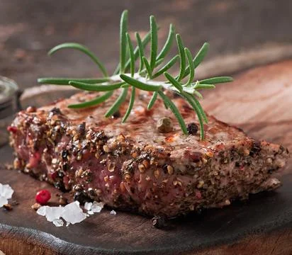 Juicy steak medium rare beef with spices Stock Photos