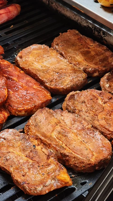 Juicy Steaks Grilling on a BBQ Видео 285647188