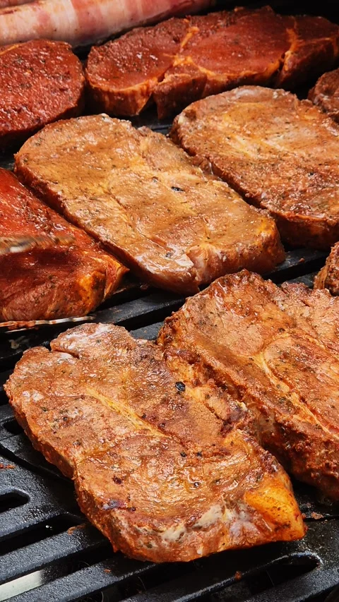 Juicy Steaks Grilling on a BBQ Stock Footage 285647212
