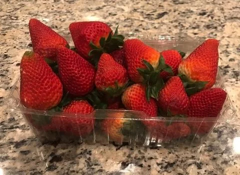 Juicy strawberries in a box Stock Photos