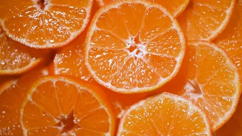 Juicy tangerine texture on rotating background. Top view. Citrus fruits. Vegan Stock Footage 125417618
