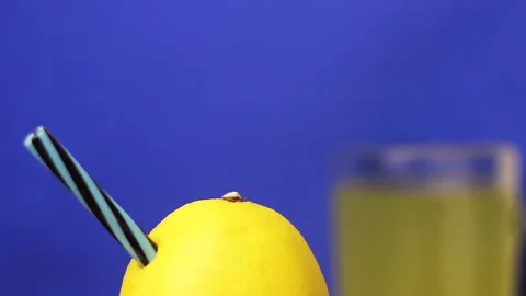 Juicy Vivid Lemon With Straw Inside For Drinking (Seamless Loop Rotation) 스톡 동영상 112028364