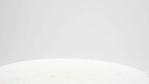 Juicy wet tomato rolling between a hand Stock Footage 81011750