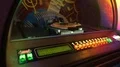 Jukebox automatically rearranging discs for playing music when coin is inserted 4k or 4k+ Resolution