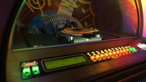 Jukebox automatically rearranging discs for playing music when coin is inserted Video stock 82034880