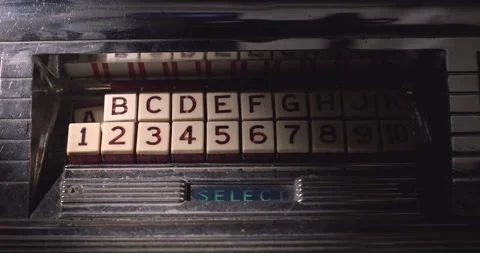 Jukebox song selection keypad with buttons pressing themselves, ghostly vintage Vidéo 327610532