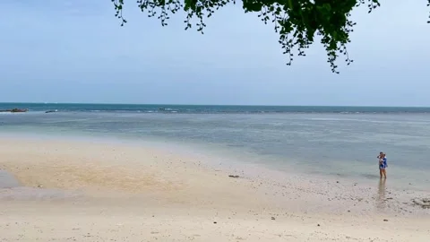 Jul, 29th 2024 Koh Phangan, Thailand Almost empty beach during low tide in Koh Stock Footage 286377863