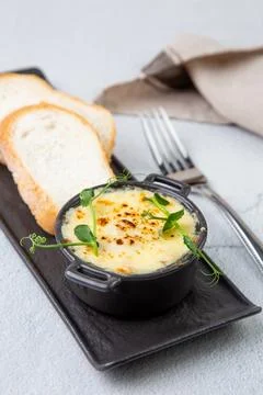 Julienne in a mug with pieces of bread side view Stock Photos