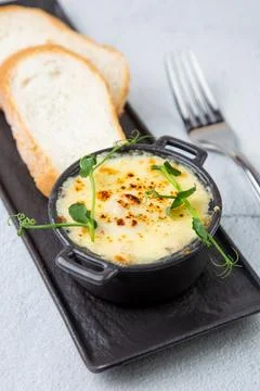 Julienne in a mug with pieces of bread side view Stock Photos