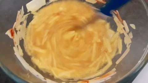Julienned potatoes, eggs, salt mix Stock Footage 342435295