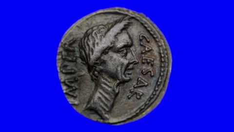 Julius Caesar Roman Denarius Coin on a Blue Screen Stock Footage 140878728