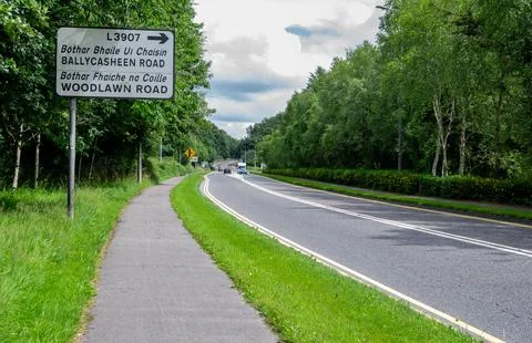 July 1, 2025 Killarney, Ireland There is a road featuring a sign displaying the Stock Photos
