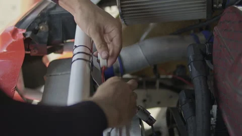 July 18, 2026, IMPACT Speed Fest, Bangkok: Mechanic working on engine Stock Footage 340608038