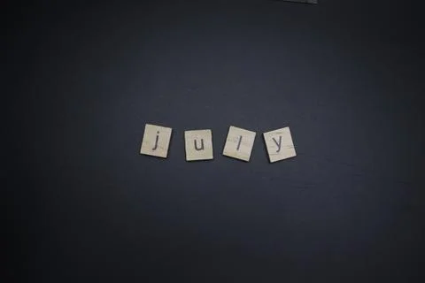 July Letters Stock Photos