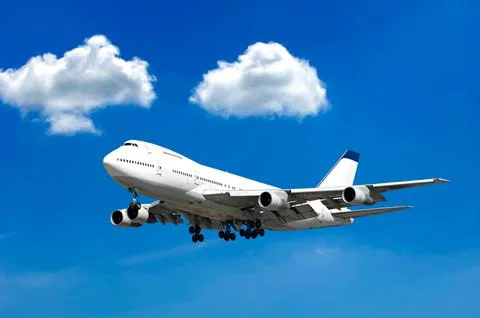 Jumbo and clouds Stock Photos