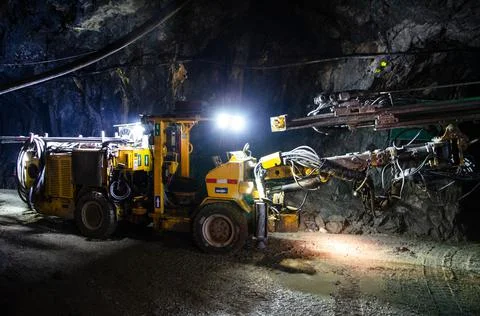 Jumbo Drill Posing at Underground Mine. Stock Photos