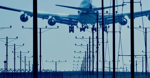 Jumbo jet airplane plane landing in LAX airport in Los Angeles city. 4K. Stock Footage