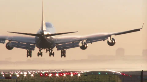 Jumbo Jet landing at sunset Stock Footage 37487339