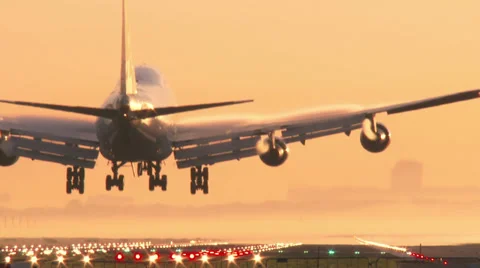 Jumbo Jet landing at sunset Stock Footage 37487595