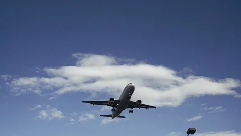 Jumbo jet plane landing in silhouette Stock Footage 88633820