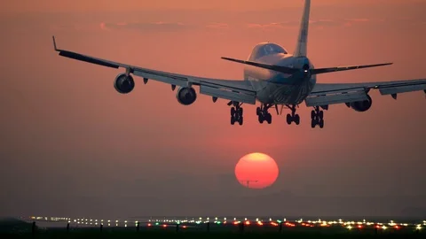 Jumbojet landing at sunset Stock-Footage 89789827