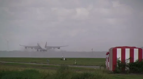 Jumbojet takes of in rain Stock Footage 7732889