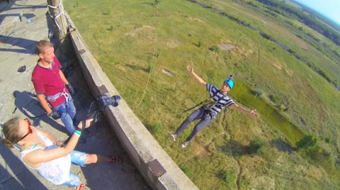 Jump backwards arms to the side Stock Footage 41432674