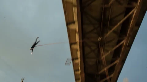 Jump off a bridge on the background of storm clouds Stock Footage 46982260