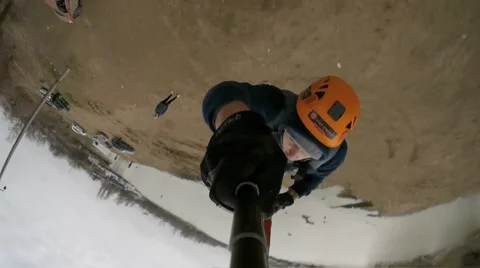 Jump to face forward while holding a camera - selfie Stock Footage 68068377