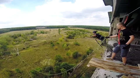Jump facing forward with his arms apart Stock Footage