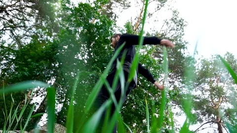 Jump of a guy on nature Stock-Footage 80319147