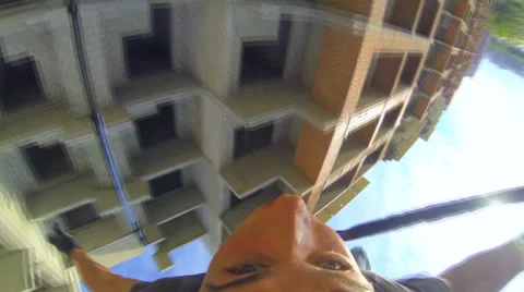 Jump headfirst hangs on a rope Stock Footage 37727675