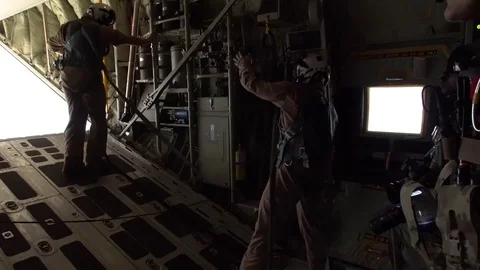 Jump master descends open rear door of C-130 Hercules prior to HALO jump Stock Footage 93445508