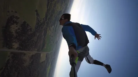 Jump from a paraglider with a parachute double backflip holding Stock Footage 202120397