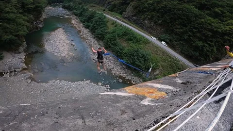 Jump from a pedestrian bridge, crazy jump from a height Stock Footage 221710000