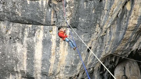 Jump Pendulum, bungee at Prohodna cave, Bulgaria. Extreme and fun sport Stock Footage 82208735