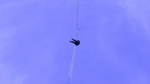 Jump Pendulum, bungee at Prohodna cave, Bulgaria. Extreme and fun sport Stock Footage 109903023