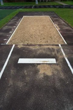 The jump pit at the school stadium. Long jump in the sand Stock Photos