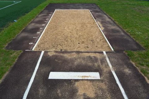 The jump pit at the school stadium. Long jump in the sand Stock Photos