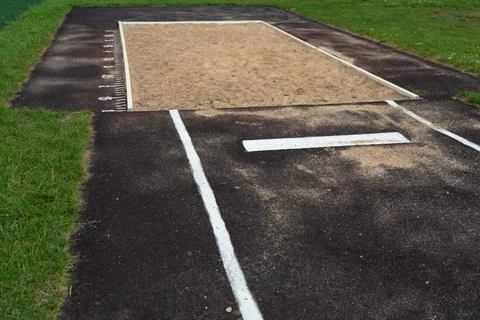 The jump pit at the school stadium. Long jump in the sand Stock Photos