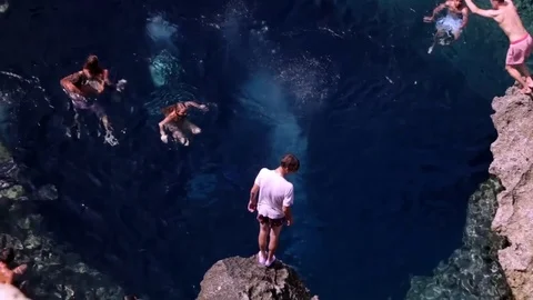 Jump from rock to grotto Stock Footage 72634560