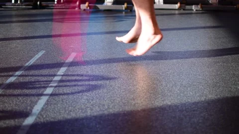 Jump rope in gym setting, close up on the feet Stock Footage 257458309