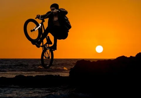 Jump on a sunset background Stock Photos