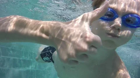 Jump into the water. The boy in the pool. Slow motion Stock-Footage 65882159