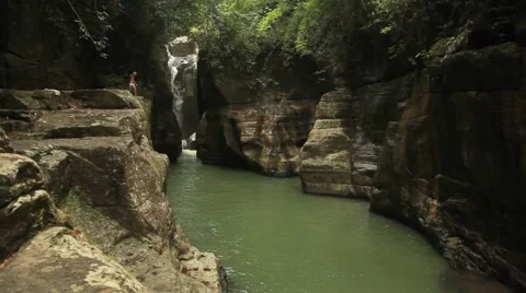 Jump into waterfall Stock Footage 44913996